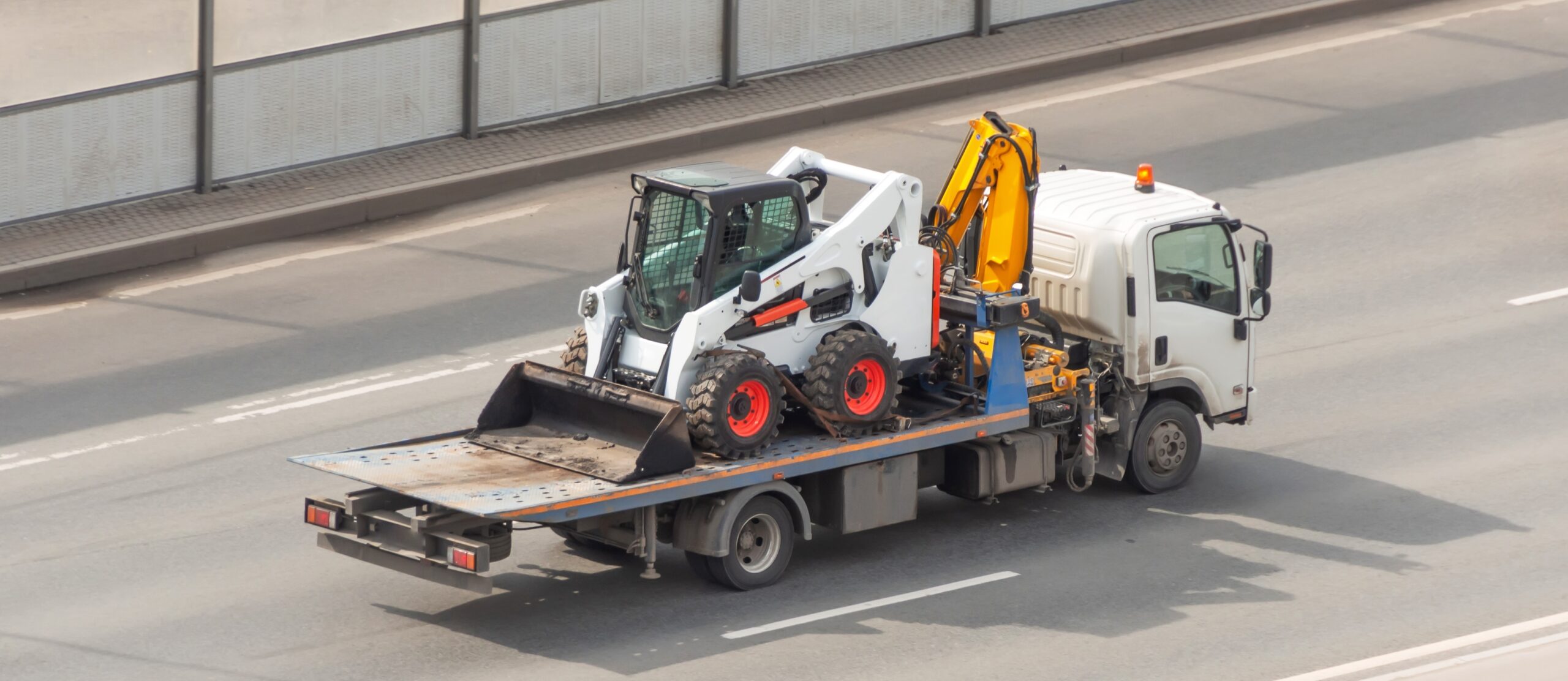 Transportation,Of,A,Mini,Tractor,By,A,Tow,Truck