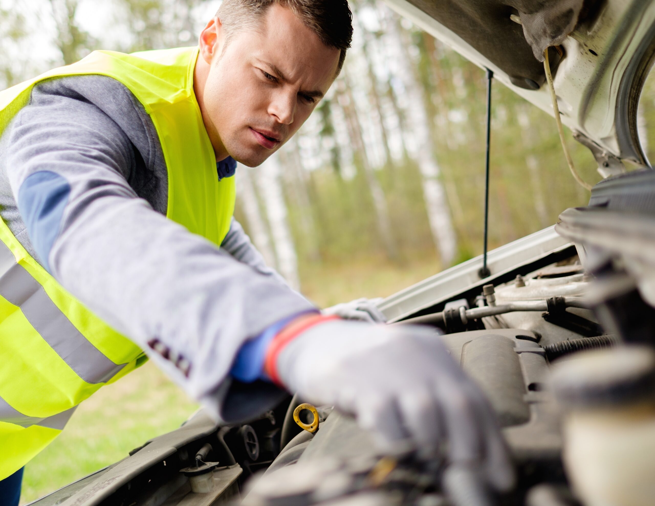 Man,Fixing,Broken,Car,On,A,Roadside